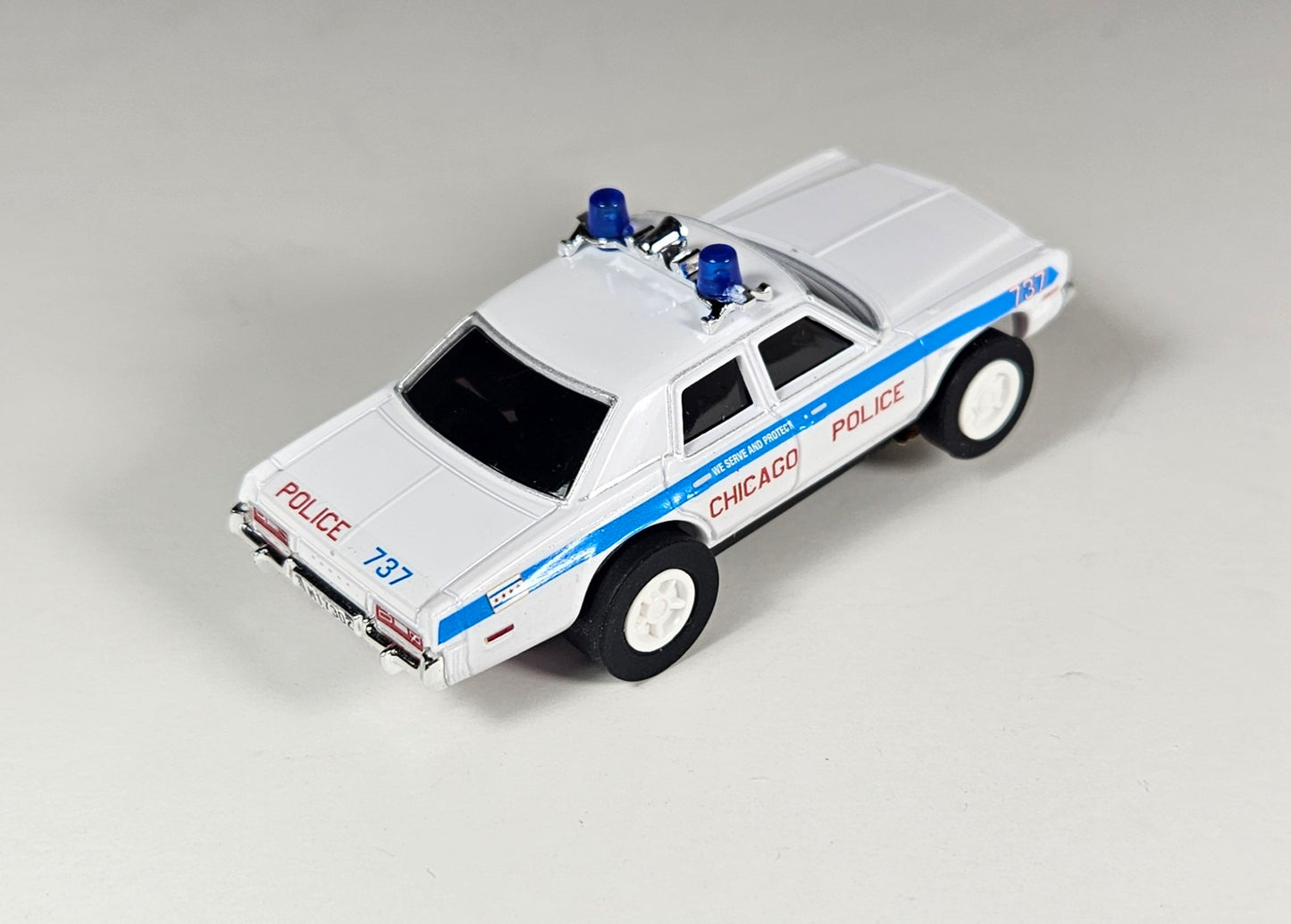 Auto World AMP Xtraction 1975 Dodge Monaco Chicago 737 Police HO Scale Slot Car