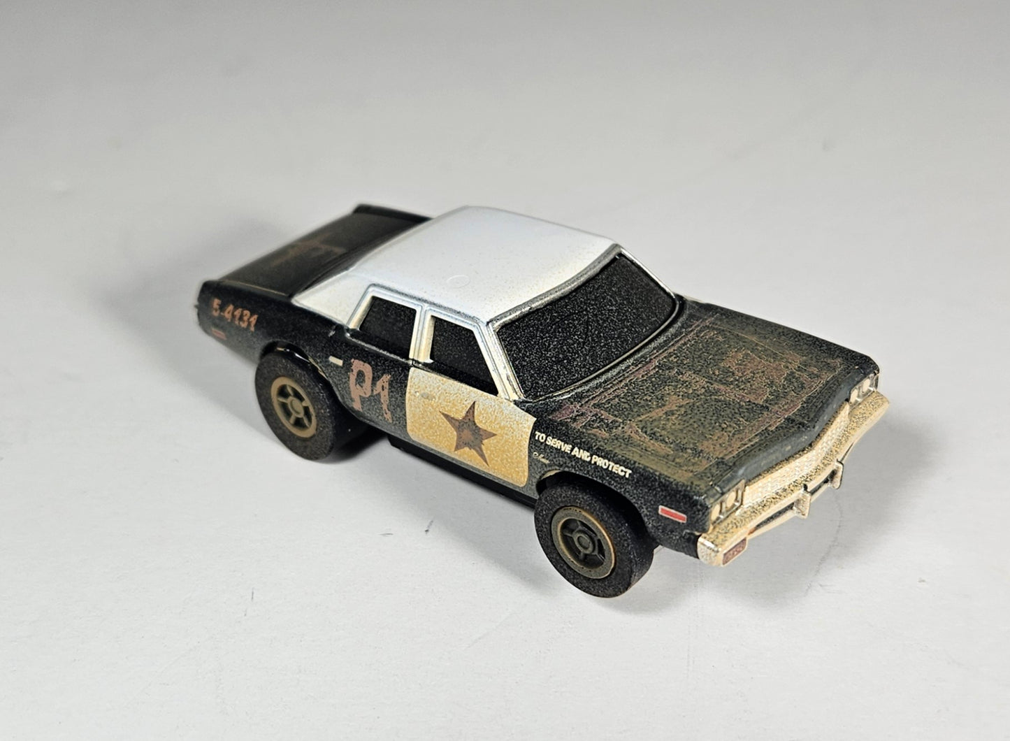 Auto World AMP Xtraction 1974 Dodge Monaco Bluesmobile HO Scale Slot Car SRS360