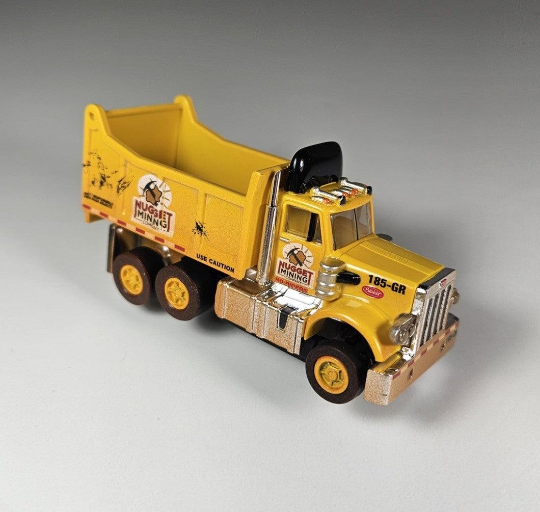 Auto World AMP Xtraction Peterbilt 359 Dump Truck (Yellow) with Working Headlights HO Scale Slot Car