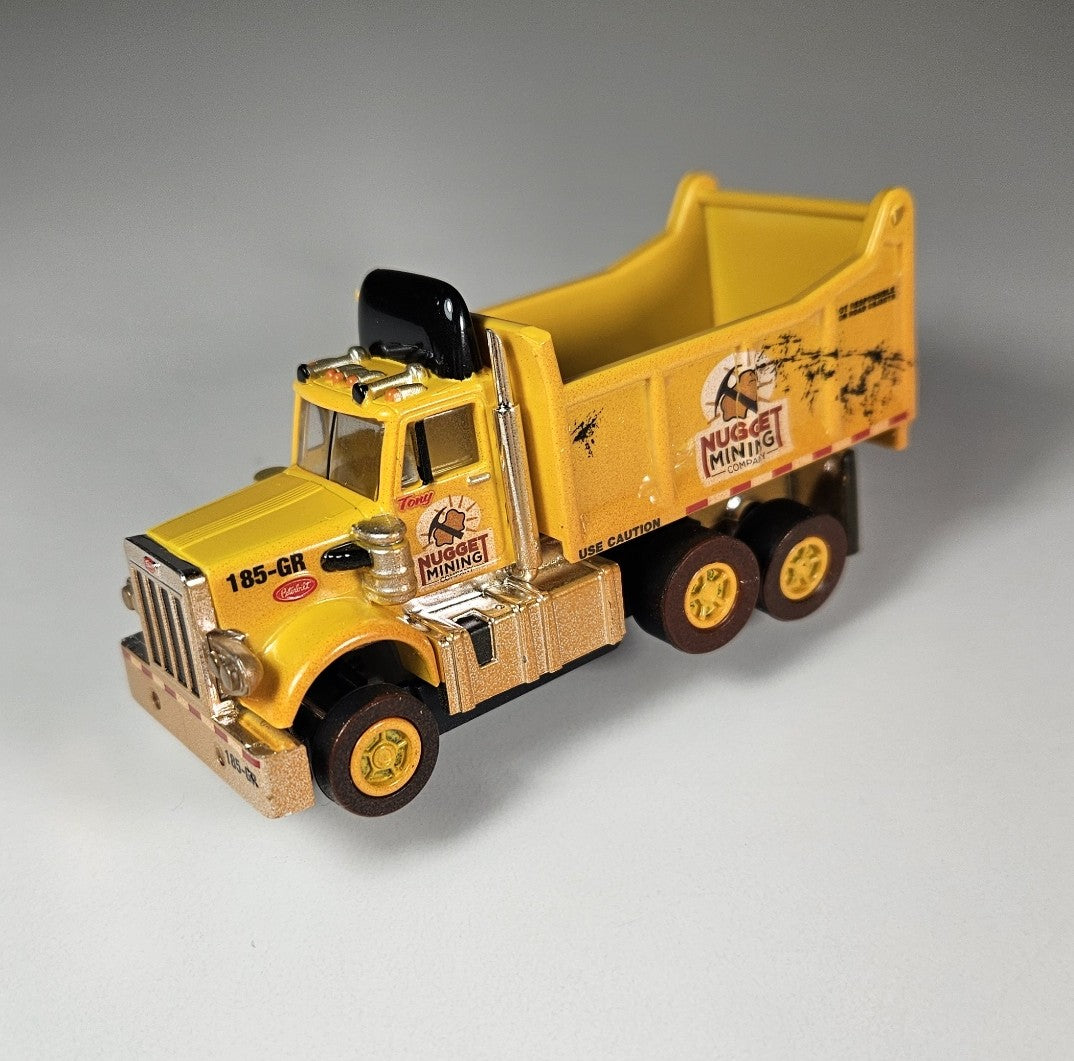 Auto World AMP Xtraction Peterbilt 359 Dump Truck (Yellow) with Working Headlights HO Scale Slot Car