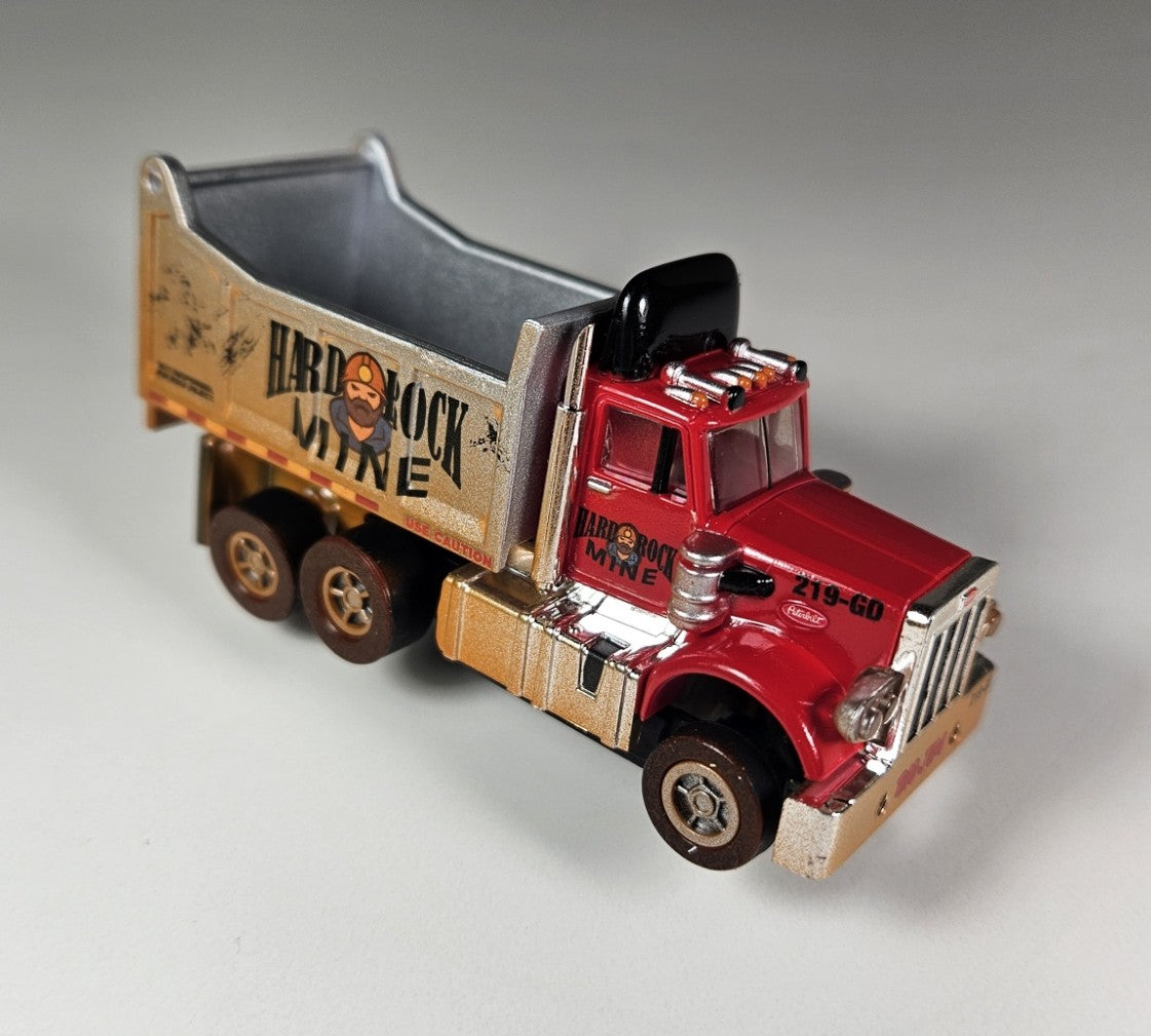 Auto World AMP Xtraction Peterbilt 359 Dump Truck (Red) with Working Headlights HO Scale Slot Car